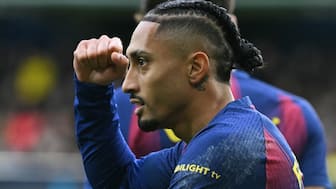 Barcelona's Brazilian forward #11 Raphinha celebrates scoring the opening goal during the Spanish league football match between Villarreal CF and FC Barcelona at La Ceramica Stadium in Vilareal on December 21, 2025. AFP