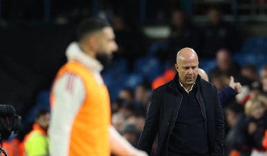 Liverpool manager Arne Slot and Mohamed Salah walk off in the Premier League. Reuters