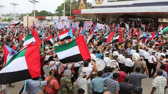 Supporters of the UAE-backed separatist Southern Transitional Council (STC) wave flags of the United Arab Emirates and of the STC, during a rally in Aden, Yemen. Reuters