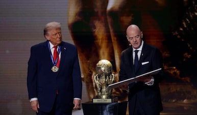 U.S. President Donald Trump (L) receives the FIFA Peace Prize from FIFA President Gianni Infantino (R) during the FIFA World Cup 2026 Final Draw at John F. Kennedy Center for the Performing Arts. Mandatory Credit:Reuters via Amber Searls-Imagn Images