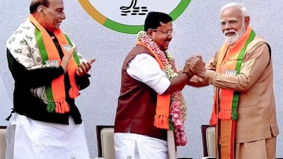 Prime Minister Narendra Modi felicitates newly elected BJP National President Nitin Nabin as the latter takes charge at party headquarters, in New Delhi. Defence Minister Rajnath Singh is also seen. @NarendraModi/YT via PTI Photo
