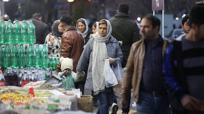 People walk on a street, as protests erupt over the collapse of the currency's value, in Tehran, Iran, January 5, 2026. Reuters File