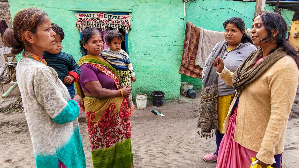 Residents discuss with municipal workers at Bhagirathpura amid the contaminated tap water crisis where several people died and fell ill, in Indore, January 2, 2026. PTI Residents discuss with municipal workers at Bhagirathpura amid the contaminated tap water crisis where several people died and fell ill, in Indore, January 2, 2026. PTI