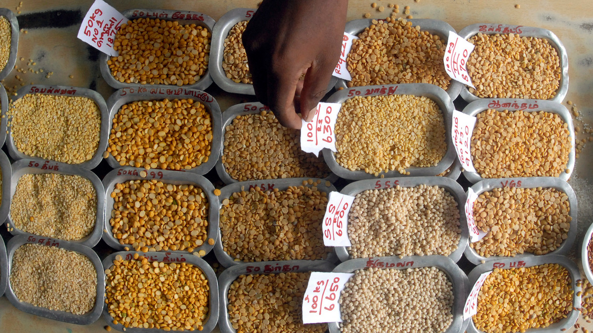 A man arranges price tags on the samples of various pulses at a wholesale market in the Chennai. Reuters A man arranges price tags on the samples of various pulses at a wholesale market in the Chennai. Reuters