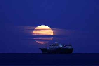 The Cold Moon, the last supermoon of 2025, illuminates the sky as a ship passes by in Chile. File image/Reuters 