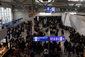 People gather as airports across Greece have suspended arrivals and departures on Sunday, after unspecified issues affecting radio frequencies, at the Eleftherios Venizelos International Airport, in Athens, Greece. Reuters