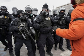 US Customs and Border Protection (CBP) agents face protesters during a demonstration outside the Whipple Federal Building in Minneapolis, Minnesota, US. File image/Reuters