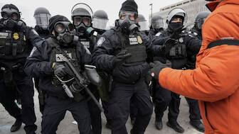 US Customs and Border Protection (CBP) agents face protesters during a demonstration outside the Whipple Federal Building in Minneapolis, Minnesota, US. File image/Reuters