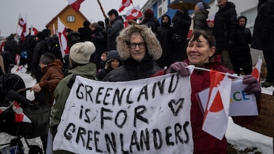 People attend a protest against US President Donald Trump's demand that the Arctic island be ceded to the US, calling for it to be allowed to determine its own future. Reuters