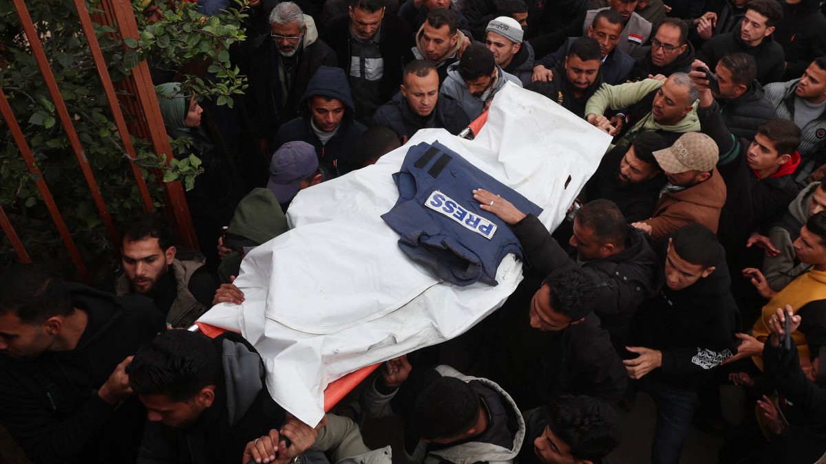 Mourners carry the body of one of the Palestinian journalists killed in an Israeli airstrike, in Khan Younis. Reuters Mourners carry the body of one of the Palestinian journalists killed in an Israeli airstrike, in Khan Younis. Reuters