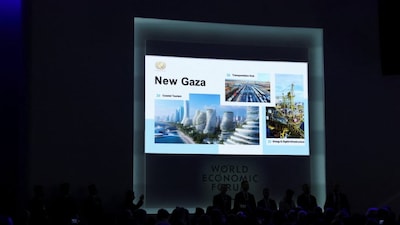 A slide titled "New Gaza" is seen on a screen during an event announcing the charter for U.S. President Donald Trump's Board of Peace initiative, aimed at resolving global conflicts, alongside the 56th annual World Economic Forum (WEF), in Davos, Switzerland, January 22, 2026. REUTERS