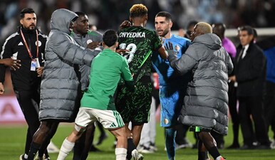 Nigeria's midfielder #18 Raphael Onyedika, Algeria's goalkeeper #23 Luca Zidane and players argue during the Africa Cup of Nations (CAN) quarter-final football match between Algeria and Nigeria at the Grand stadium in Marrakesh on January 10, 2026. AFP
