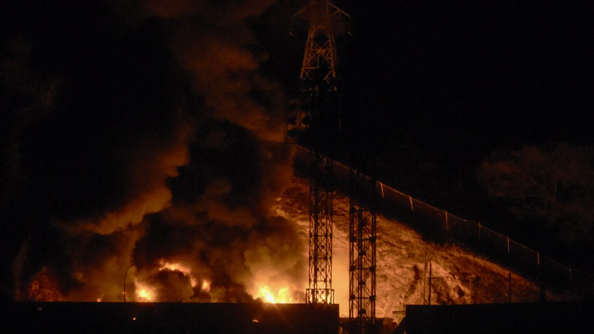 Picture of fire at Fuerte Tiuna, Venezuela's largest military complex, after a series of explosions in Caracas on January 3, 2026. Loud explosions, accompanied by sounds resembling aircraft flyovers, were heard in Caracas around 2:00 am (0600 GMT) on January 3, an AFP journalist reported. The explosions come as US President Donald Trump, who has deployed a navy task force to the Caribbean, raised the possibility of ground strikes against Venezuela. (Photo by Luis JAIMES / AFP) Picture of fire at Fuerte Tiuna, Venezuela's largest military complex, after a series of explosions in Caracas on January 3, 2026. Loud explosions, accompanied by sounds resembling aircraft flyovers, were heard in Caracas around 2:00 am (0600 GMT) on January 3, an AFP journalist reported. The explosions come as US President Donald Trump, who has deployed a navy task force to the Caribbean, raised the possibility of ground strikes against Venezuela. (Photo by Luis JAIMES / AFP)