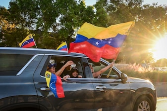 People react to the news of the capture of Venezuelan President Nicolas Maduro, after US military actions in Venezuela this morning, in Doral, Florida, near Miami, on January 3, 2026.  (AFP)