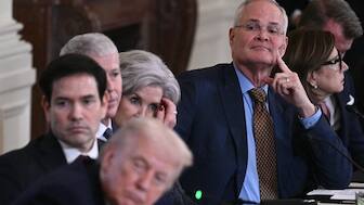ExxonMobil CEO Darren Woods (R) attends a meeting with US President Donald Trump (L) and oil company executives in the East Room of the White House in Washington, DC on January 9, 2026. AFP