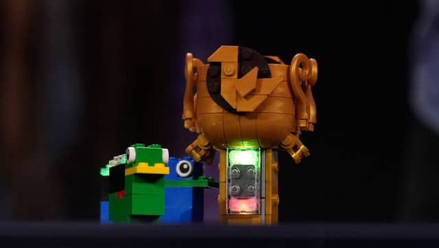 The bricks, which are 1.6 cm by 3.2 cm, have been encoded to respond to other Lego figures. AP