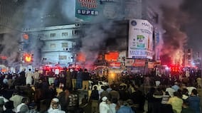 Massive fire rips through dozens of shops at a mall in Pakistan, killing 3 people