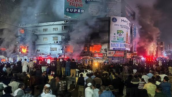 Massive fire rips through dozens of shops at a mall in Pakistan, killing 3 people
