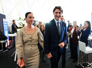 Former Prime Minister Justin Trudeau holds hands with Katy Perry as they leave an event during the World Economic Forum in Davos, Switzerland. AP
