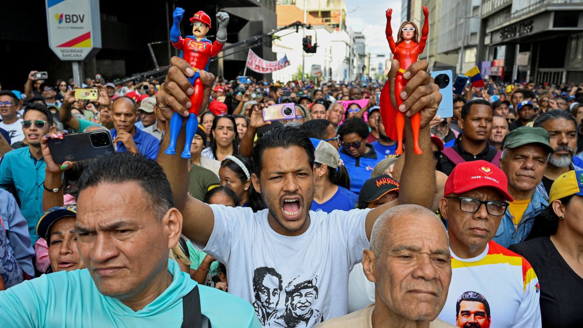 A demonstrator holds action figures of "Super Bigote" (Super Mustache) and "Cilita", superheroes inspired by US-deposed Venezuelan President Nicolas Maduro and his wife Cilia Flores, during a march outside the National Assembly, in Caracas, Venezuela January 5, 2026. File Image/Reuters A demonstrator holds action figures of "Super Bigote" (Super Mustache) and "Cilita", superheroes inspired by US-deposed Venezuelan President Nicolas Maduro and his wife Cilia Flores, during a march outside the National Assembly, in Caracas, Venezuela January 5, 2026. File Image/Reuters