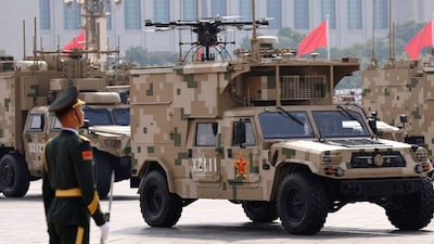 A member of the People's Liberation Army stands as information operations group vehicles take part during a military parade to mark the 80th anniversary of the end of World War Two, in Beijing, China, September 3, 2025. Representational Image/Reuters