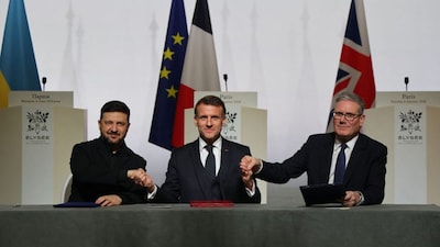 Ukraine's President Volodymyr Zelenskyy, France's President Emmanuel Macron, and British Prime Minister Sir Keir Starmer shake hands upon the signing of the declaration on deploying post-ceasefire force in Ukraine during the Coalition of the Willing summit on security guarantees for Ukraine at the Elysee Palace in Paris on January 6, 2026. (Photo: Ludovid Marin/Pool/AFP)