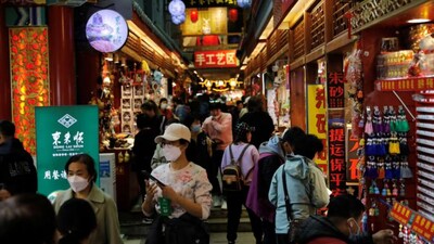 People visit a market at the tourism site of Qianmen street in Beijing, China, on March 14, 2023. (Representational Photo, Credit: Tingshu Wang/Reuters)