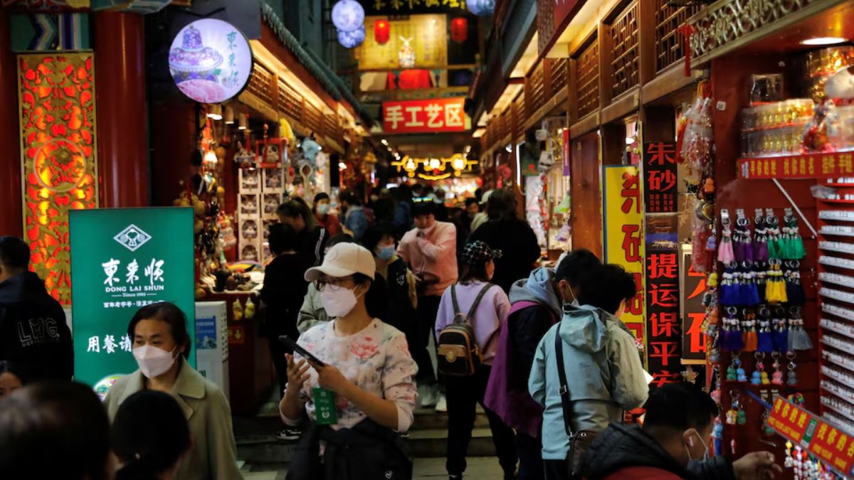 People visit a market at the tourism site of Qianmen street in Beijing, China, on March 14, 2023. (Representational Photo, Credit: Tingshu Wang/Reuters) People visit a market at the tourism site of Qianmen street in Beijing, China, on March 14, 2023. (Representational Photo, Credit: Tingshu Wang/Reuters)