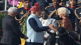 Prime Minister Narendra Modi greets European Commission President Ursula von der Leyen, next to India's President Droupadi Murmu, as they arrive to attend the Republic Day parade in New Delhi, on Monday. Reuters

