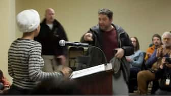 A man shouts at US Representative Ilhan Omar (D-MN) after spraying her, during a town hall meeting days after a man identified as Alex Pretti was fatally shot by federal immigration agents trying to detain him, in Minneapolis, Minnesota, US, January 27, 2026, in a still image from video. File Image/Reuters