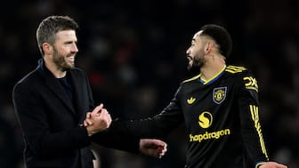 Michael Carrick celebrates with Matheus Cunha following Manchester United's 3-2 victory over Arsenal at the Emirates Stadium. Reuters