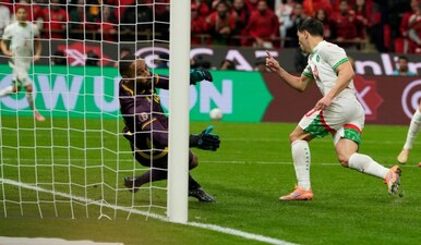 Morocco's Brahim Abdelkader Díaz, right, scores his side's opening goal during the Africa Cup of Nations quarterfinal soccer match between Cameroon and Morocco, in Rabat, Morocco, Friday, Jan. 9, 2026. (AP Photo)