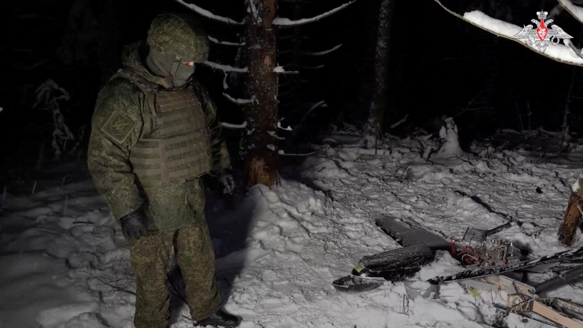 A Russian service member stands next to the remains of a drone, which, according to the Russian Defence Ministry, was downed during the repelling of an alleged Ukrainian attack on the Russian presidential residence in the Novgorod Region, in an unknown location in Russia, in this still image from a video released on December 31, 2025. Reuters File A Russian service member stands next to the remains of a drone, which, according to the Russian Defence Ministry, was downed during the repelling of an alleged Ukrainian attack on the Russian presidential residence in the Novgorod Region, in an unknown location in Russia, in this still image from a video released on December 31, 2025. Reuters File