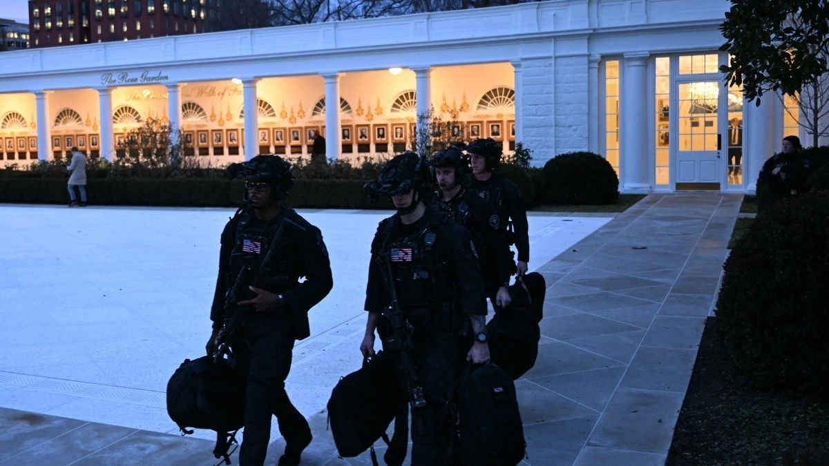 A US Secret Service counter-assault team walks past the Rose Garden at the White House in Washington, DC, on January 13, 2026.- AFP A US Secret Service counter-assault team walks past the Rose Garden at the White House in Washington, DC, on January 13, 2026.- AFP