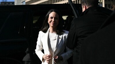 Venezuelan opposition leader Maria Corina Machado exits a vehicle as she arrives near the White House ahead of a meeting with US President Donald Trump, in Washington, DC on January 15, 2026.- AFP