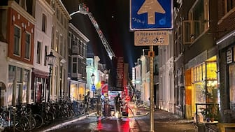 Firefighters extinguish the fire at the scene of an explosion in Utrecht, Netherlands, Thursday, Jan. 15, 2026. (AP Photo/Ahmad Seir)

