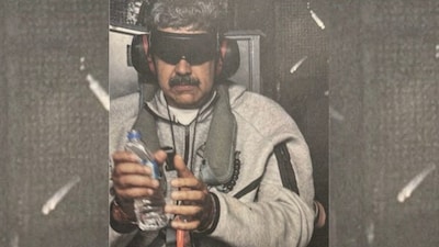 This image posted on US President Donald Trump's Truth Social account on January 3, 2026, shows what President Trump says is Venezuela's President Nicolas Maduro onboard the USS Iwo Jima after the US military captured him on January 3, 2026.- AFP