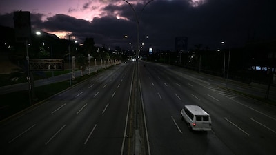 Venezuela remained in a state of uneasy calm on Sunday, a day after President Nicolás Maduro was overthrown and captured in a U.S. military operation.
Caracas appeared unusually subdued, with little traffic on the streets and most convenience stores, petrol stations and other businesses shut.
On Saturday, anxious residents had formed long queues at shops and fuel stations, rushing to stock up on supplies amid fears of unrest. Normally busy roads used by runners and cyclists were largely deserted, while armed civilians and members of the military stood guard at the presidential palace.
Beyond the capital, in La Guira state, families whose homes were damaged by explosions during the operation that led to the capture of Maduro and his wife were still clearing rubble. Some buildings suffered severe structural damage, with walls blown open.- AFP