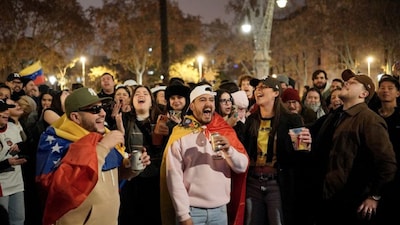 Protesters take part in a demonstration in support of the Venezuelan people following the US military operation in Venezuela to capture the Venezuelan president, in Barcelona on January 4, 2026.- AFP
