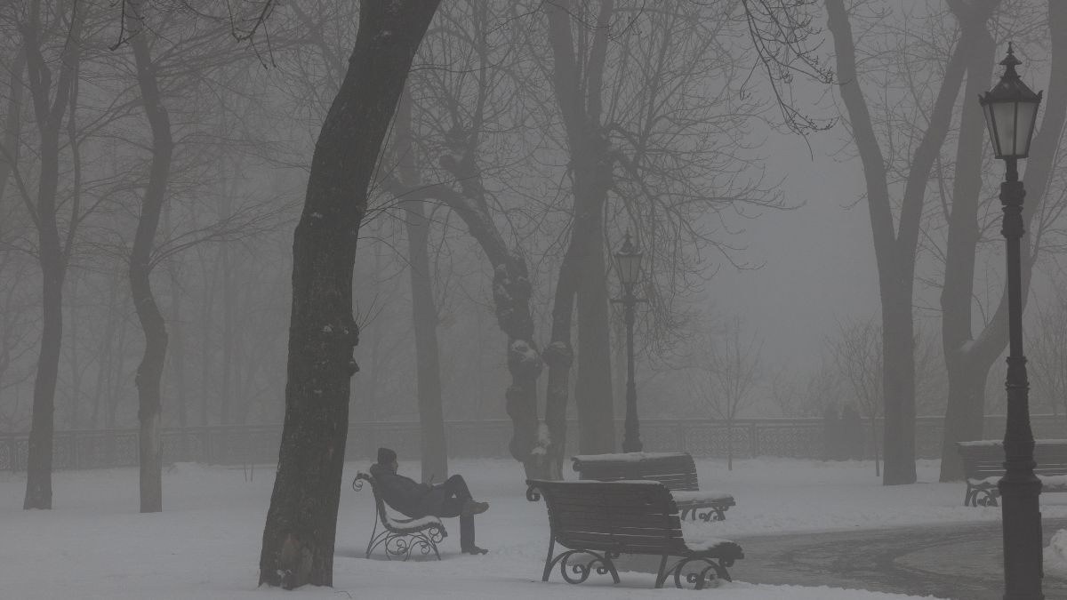 A man sits on a bench on a foggy day in a snow-covered park in Kyiv on January 7, 2026, amid the Russian invasion of Ukraine.- AFP A man sits on a bench on a foggy day in a snow-covered park in Kyiv on January 7, 2026, amid the Russian invasion of Ukraine.- AFP