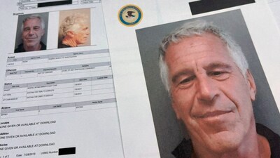 FILE - Documents that were included in the U.S. Department of Justice release of the Jeffrey Epstein files are photographed Friday, Jan. 2, 2026. (AP Photo/Jon Elswick, File)- AP

