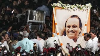 The mortal remains of the late Maharashtra Deputy Chief Minister Ajit Pawar arrive at the Vidya Pratishthan College ground for public homage at Baramati in Pune district. (Image: PTI)