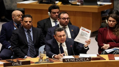 Venezuela Ambassador to the United Nations Samuel Reinaldo Moncada Acosta speaks as he holds up a news article, during a UN Security Council meeting on US strikes and the capture of Venezuelan President Nicolas Maduro and his wife, Cilia Flores, at the United Nations headquarters in New York, US, on January 5, 2026. Reuters