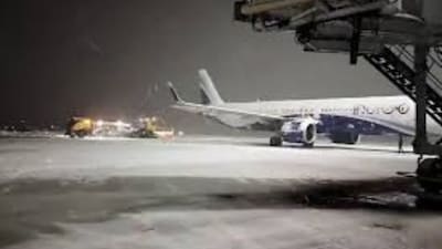 Flight operations suspended at Srinagar airport as heavy snowfall renders runway unsafe.