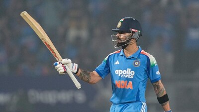 Virat Kohli celebrates after completing his half-century during the first ODI between India and New Zealand in Vadodara on Sunday, 11 January. PTI
