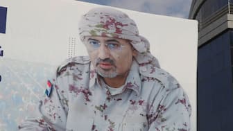 A billboard displays an image of Aidarous al-Zubaidi, the leader of Yemen's Southern Transitional Council (STC), who, according to the Saudi-backed coalition, fled to an unknown destination, in Aden, Yemen, on Wednesday. Reuters

