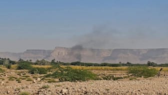 This image grab from an AFPTV footage shows Smoke billowing after airstrikes that killed seven people in Yemen as a Saudi-led coalition hit back against a sweeping advance by the UAE-backed Southern Transition Council (STC) that threatens to spiral into a major confrontation. AFP
