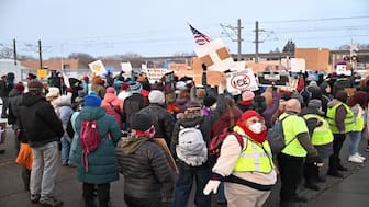 Protesters gather outside the Bishop Henry Whipple Federal Building on Thursday in Minneapolis. AP