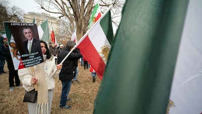 Activists take part in a rally supporting protestors in Iran at Lafayette Square, across from the White House in Washington, DC on January 3, 2026. (AFP)