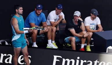 Carlos Alcaraz with former coach Juan Carlos Ferrero during a match. Image: Reuters